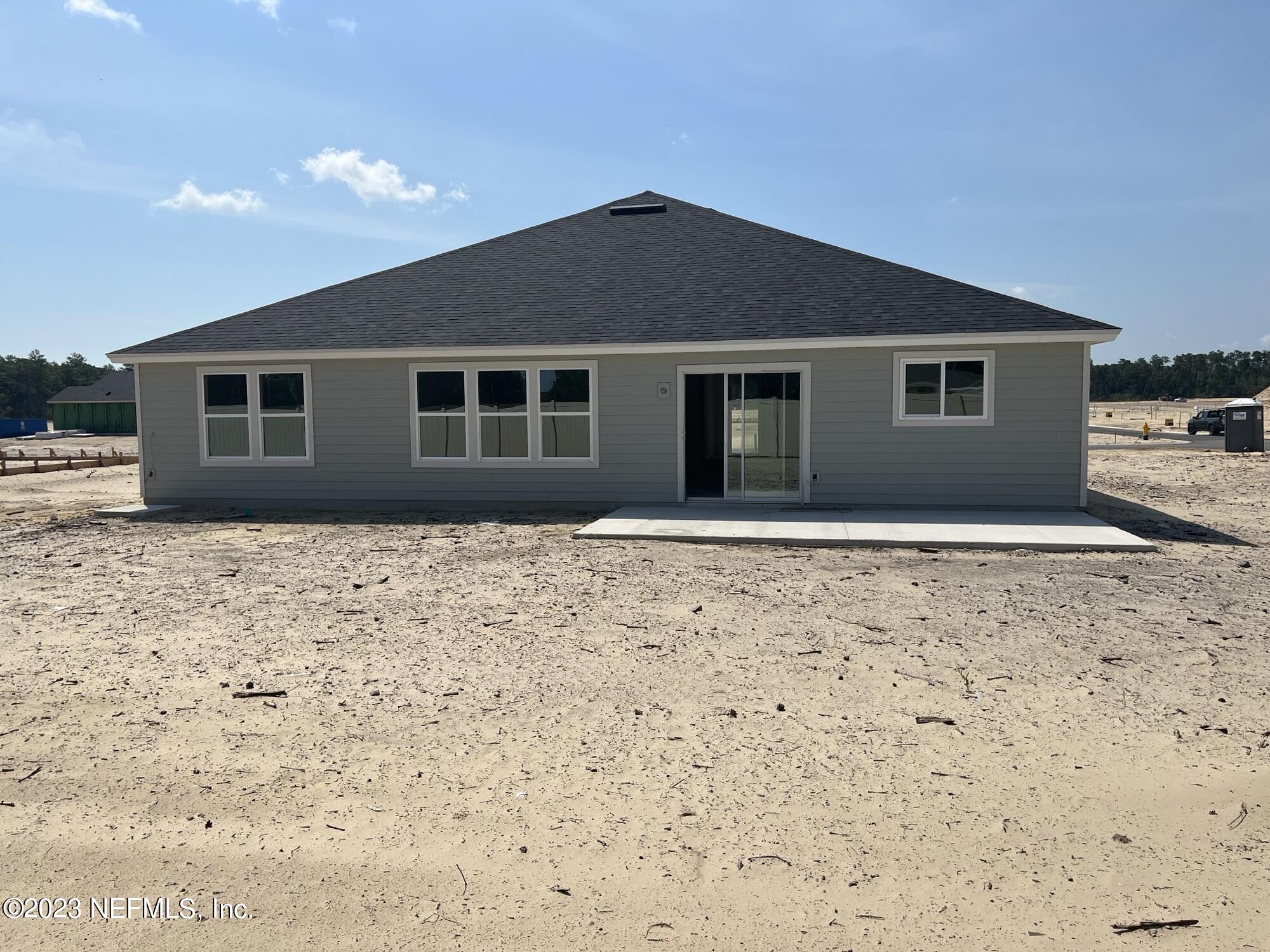 241 Sangria St. Augustine, FL 32086 - Photo 6 of 10 a house that has a tree in front of it