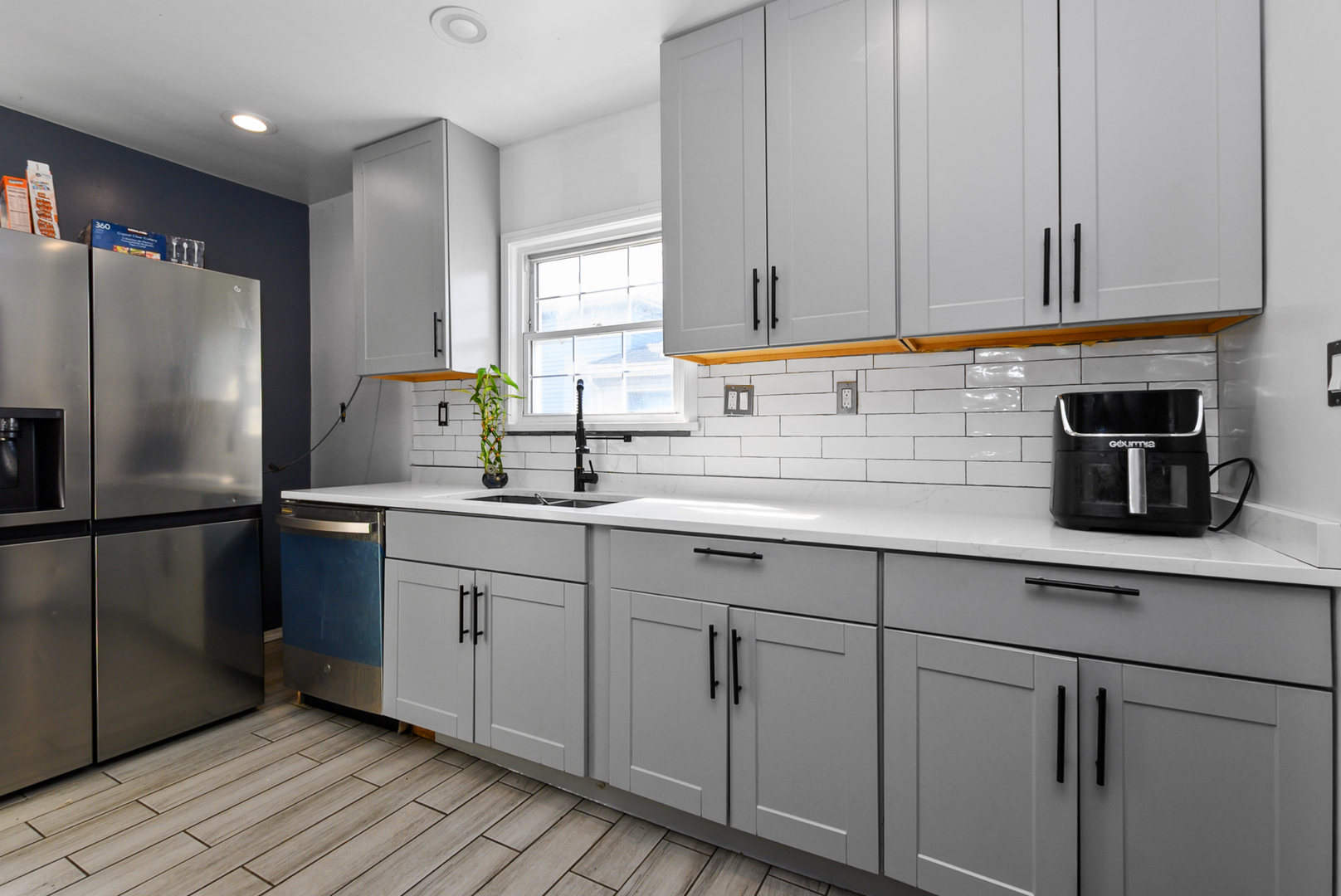 3359 Ann Street Lansing, IL 60438 - Photo 5 of 13 a kitchen with white cabinets and refrigerator