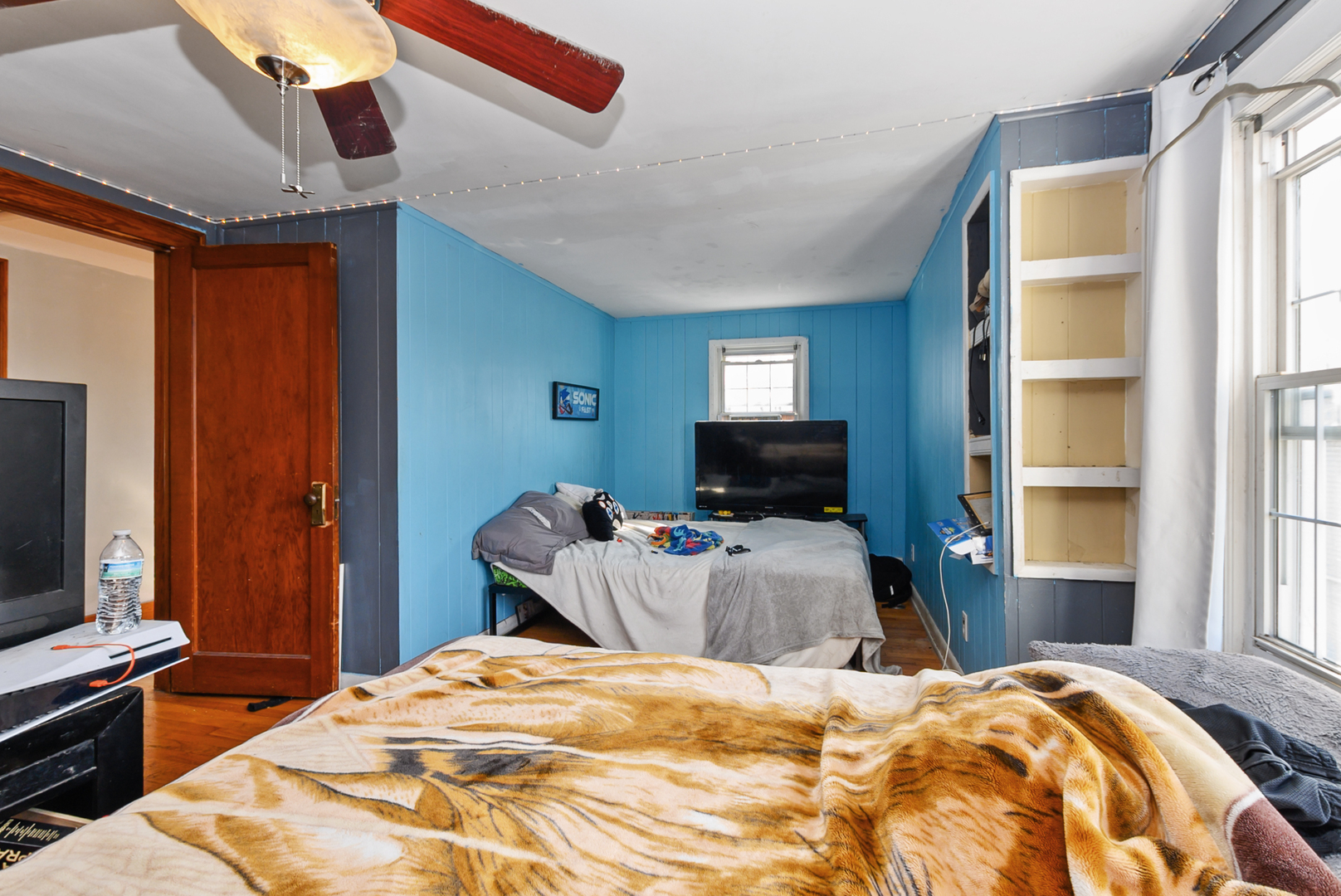 3359 Ann Street Lansing, IL 60438 - Photo 8 of 13 a bedroom with a bed and a flat screen tv