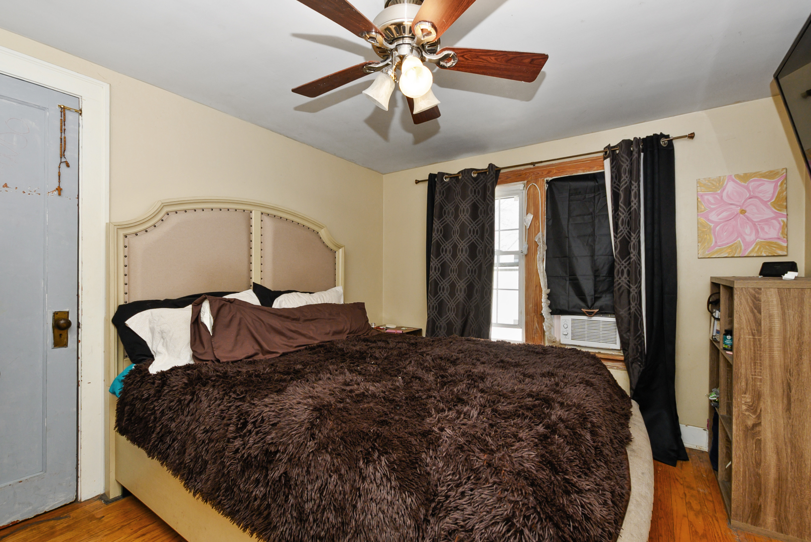 3359 Ann Street Lansing, IL 60438 - Photo 9 of 13 a bedroom with a bed dresser and a window
