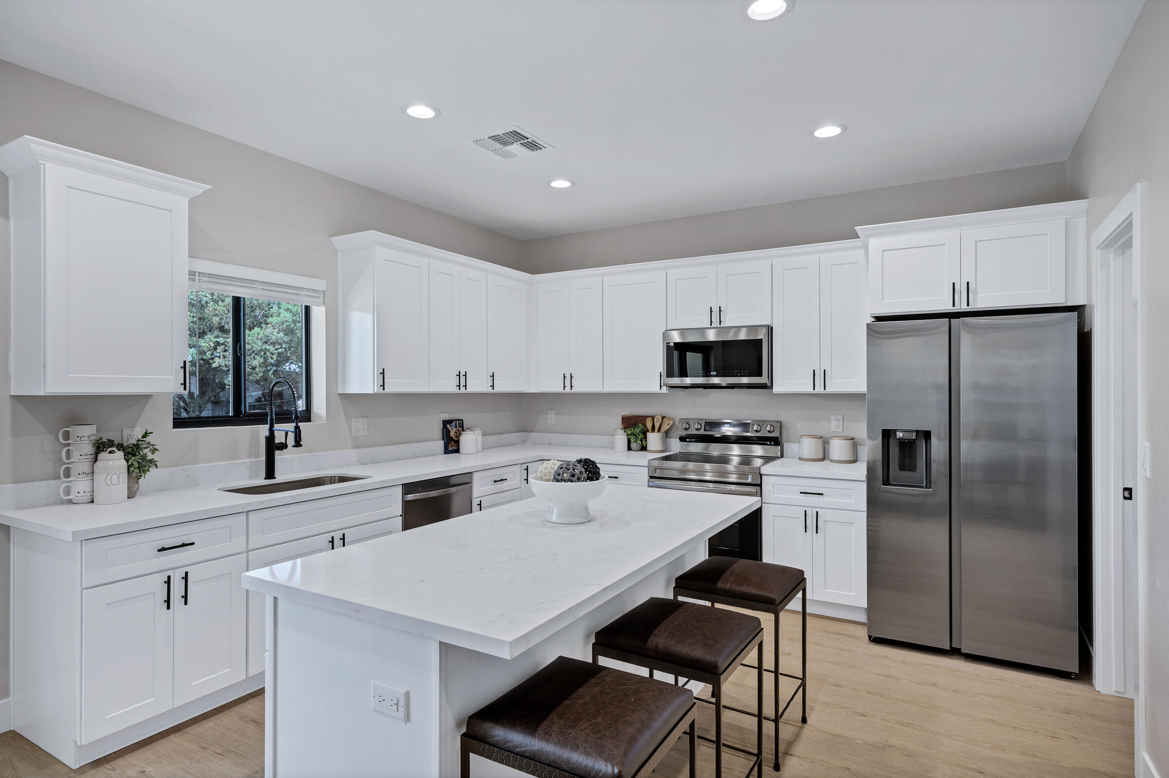 1105 East Frontier Street Payson, AZ 85541 - Photo 11 of 26 a kitchen with white cabinets and stainless steel appliances