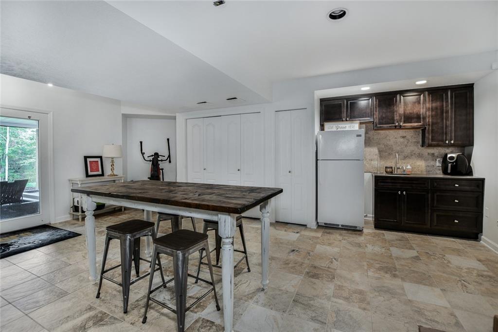 450 McKinney Road Wexford, PA 15090 - Photo 23 of 25 Another view of the Game room with kitchenette and sliding doors that lead to covered patio!