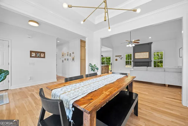 a kitchen with kitchen island granite countertop a sink a stove and refrigerator