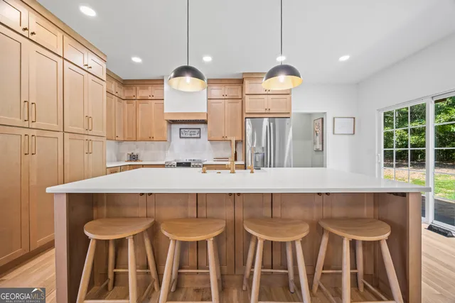 a bathroom with a sink toilet and a mirror
