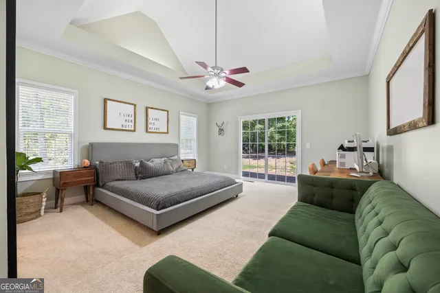 a bedroom with furniture and a window