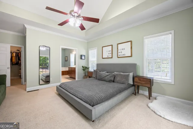 a view of a livingroom with a ceiling fan and window