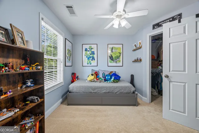 a view of a hallway with wooden floor and furniture