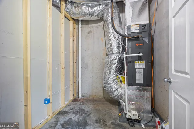 a view of a house with a big yard and large trees