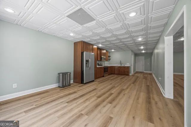 a view of a house with a yard and sitting area