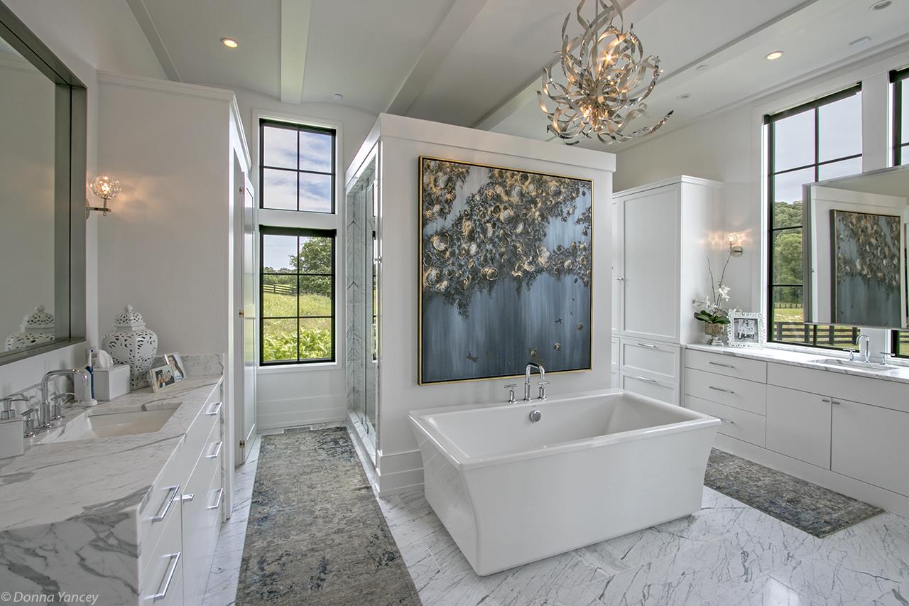 5747 Garrison Road Franklin, TN 37064 - Photo 15 of 30 a bathroom with a tub sink shower and mirror