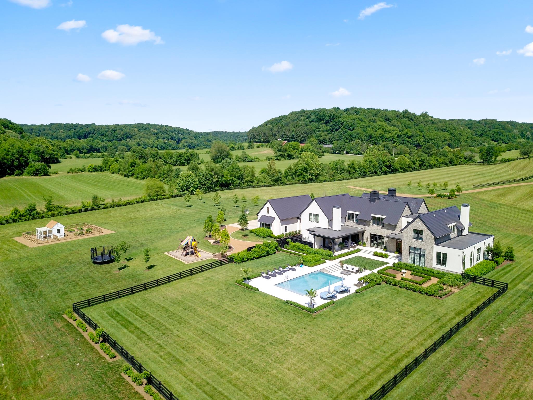 5747 Garrison Road Franklin, TN 37064 - Photo 29 of 30 a view of a lake with lawn chairs and large trees