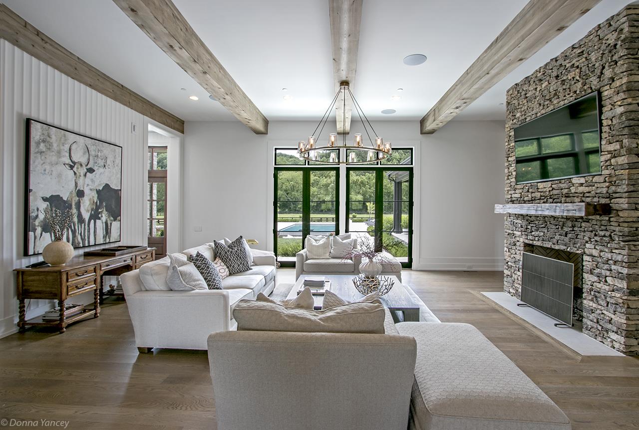 5747 Garrison Road Franklin, TN 37064 - Photo 6 of 30 a living room with furniture fireplace and large windows