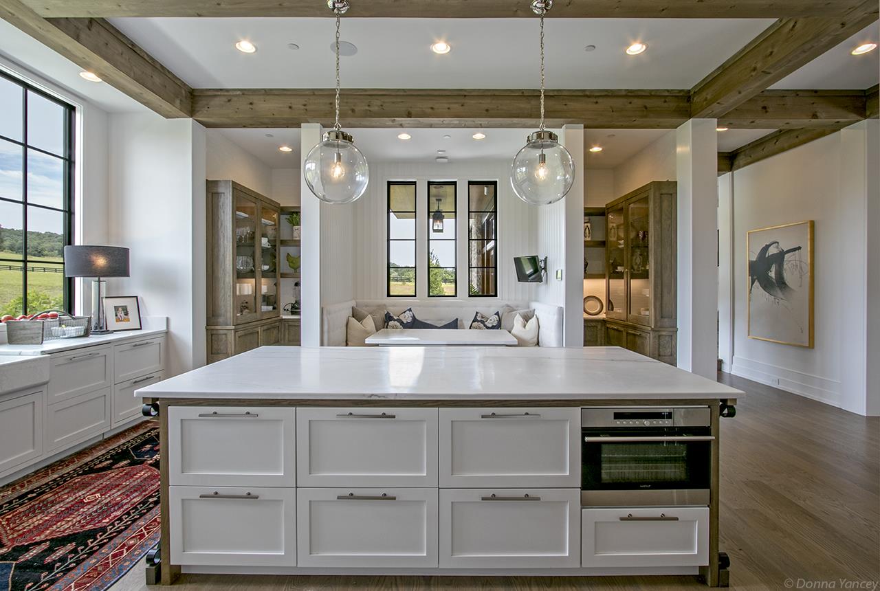 5747 Garrison Road Franklin, TN 37064 - Photo 9 of 30 a kitchen with kitchen island granite countertop a stove and a sink