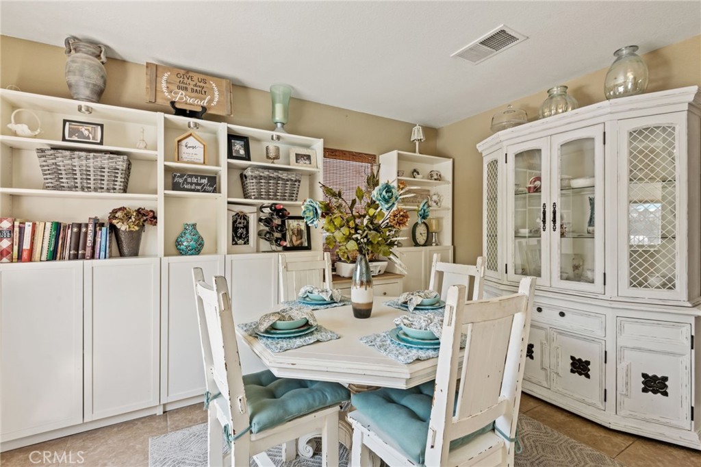 7615 Canberra Way Riverside, CA 92508 - Photo 12 of 37 a view of a dining room with furniture window and wooden floor