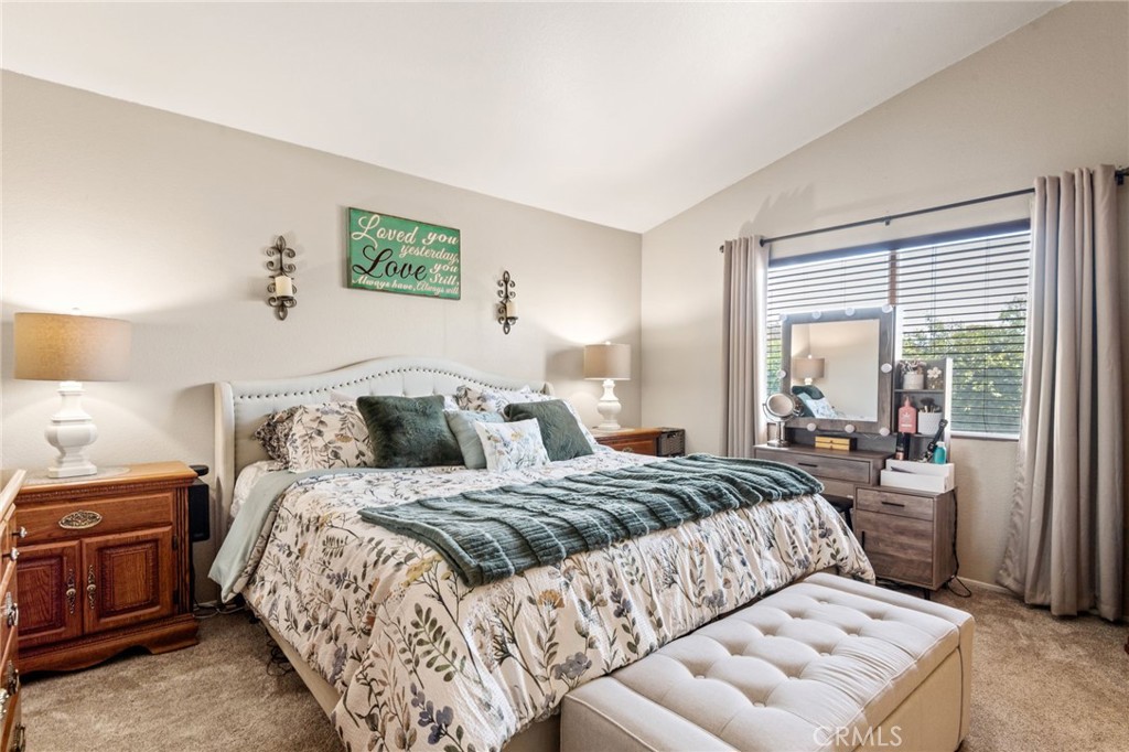 7615 Canberra Way Riverside, CA 92508 - Photo 16 of 37 a bedroom with a bed and a couch