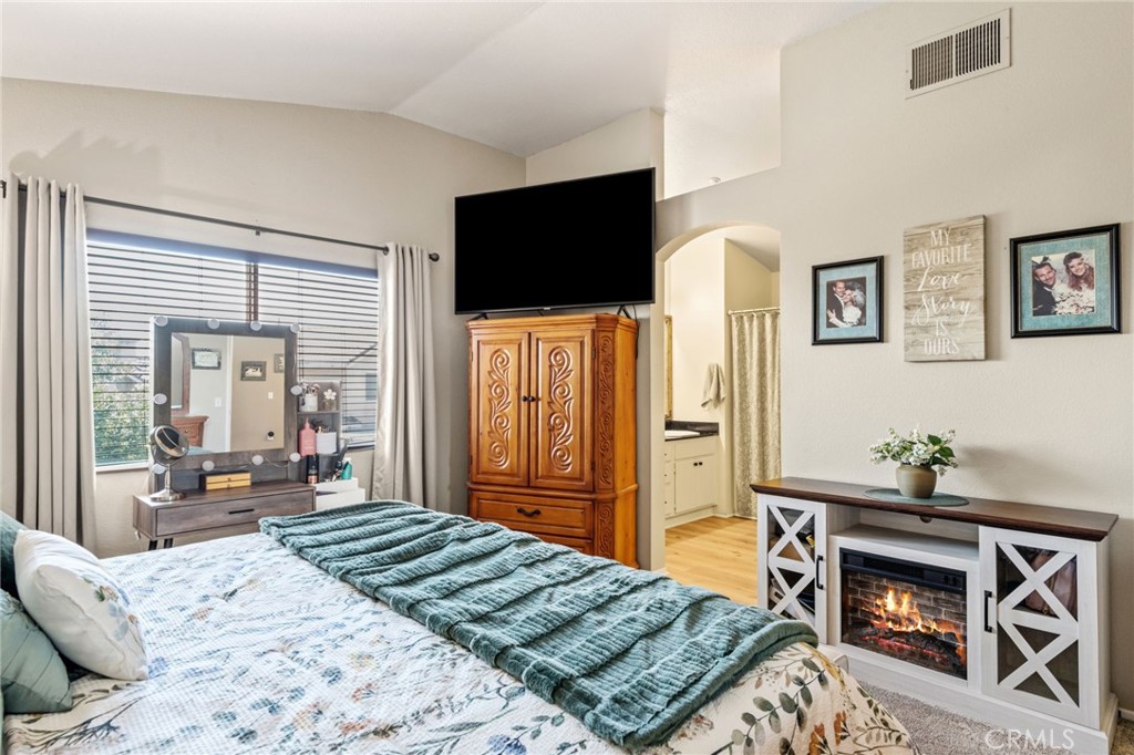 7615 Canberra Way Riverside, CA 92508 - Photo 17 of 37 a bedroom with a bed and flat screen tv