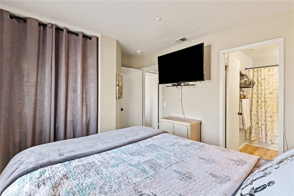 7615 Canberra Way Riverside, CA 92508 - Photo 20 of 37 a bedroom with a bed and a flat screen tv