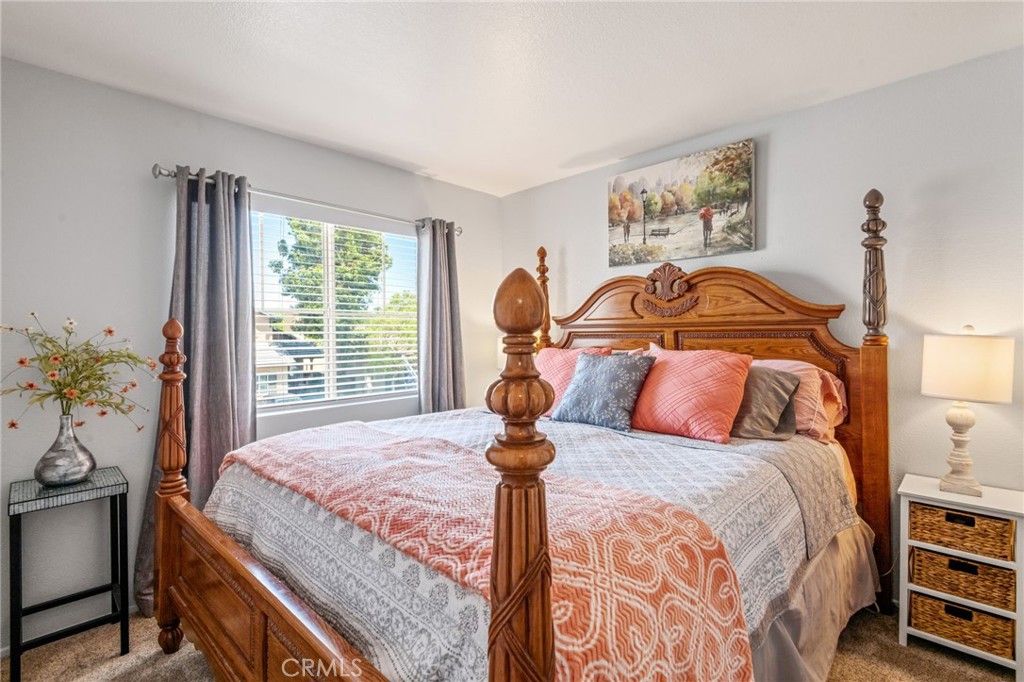 7615 Canberra Way Riverside, CA 92508 - Photo 22 of 37 a bedroom with a bed and window