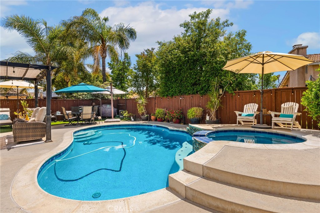 7615 Canberra Way Riverside, CA 92508 - Photo 27 of 37 a view of a swimming pool with a patio