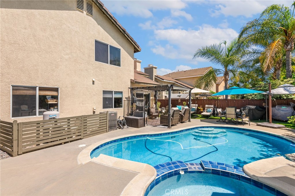7615 Canberra Way Riverside, CA 92508 - Photo 29 of 37 a view of a swimming pool with chairs