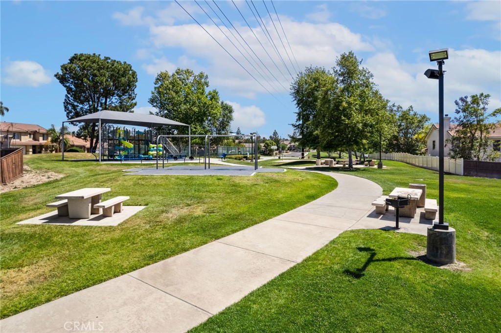 7615 Canberra Way Riverside, CA 92508 - Photo 33 of 37 a view of a table and chairs in the garden
