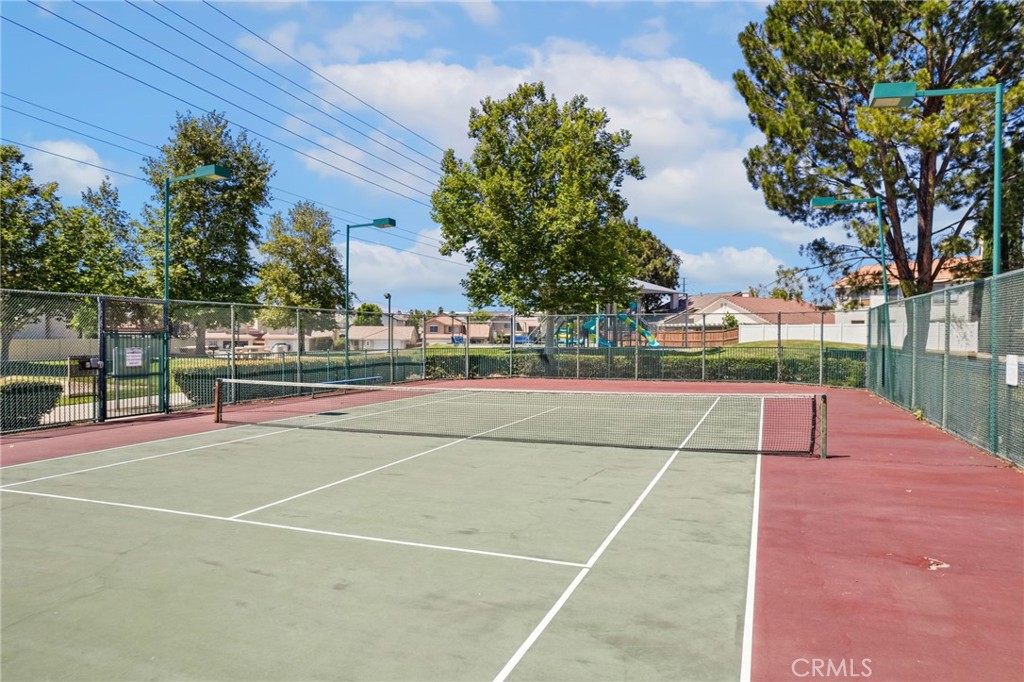 7615 Canberra Way Riverside, CA 92508 - Photo 35 of 37 a tennis court that has tennis net
