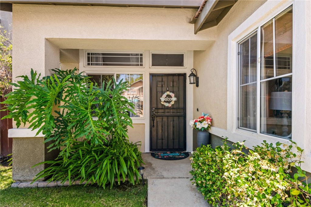 7615 Canberra Way Riverside, CA 92508 - Photo 4 of 37 a front view of a house with plants