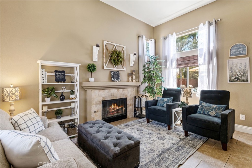 7615 Canberra Way Riverside, CA 92508 - Photo 6 of 37 a living room with furniture and a fireplace