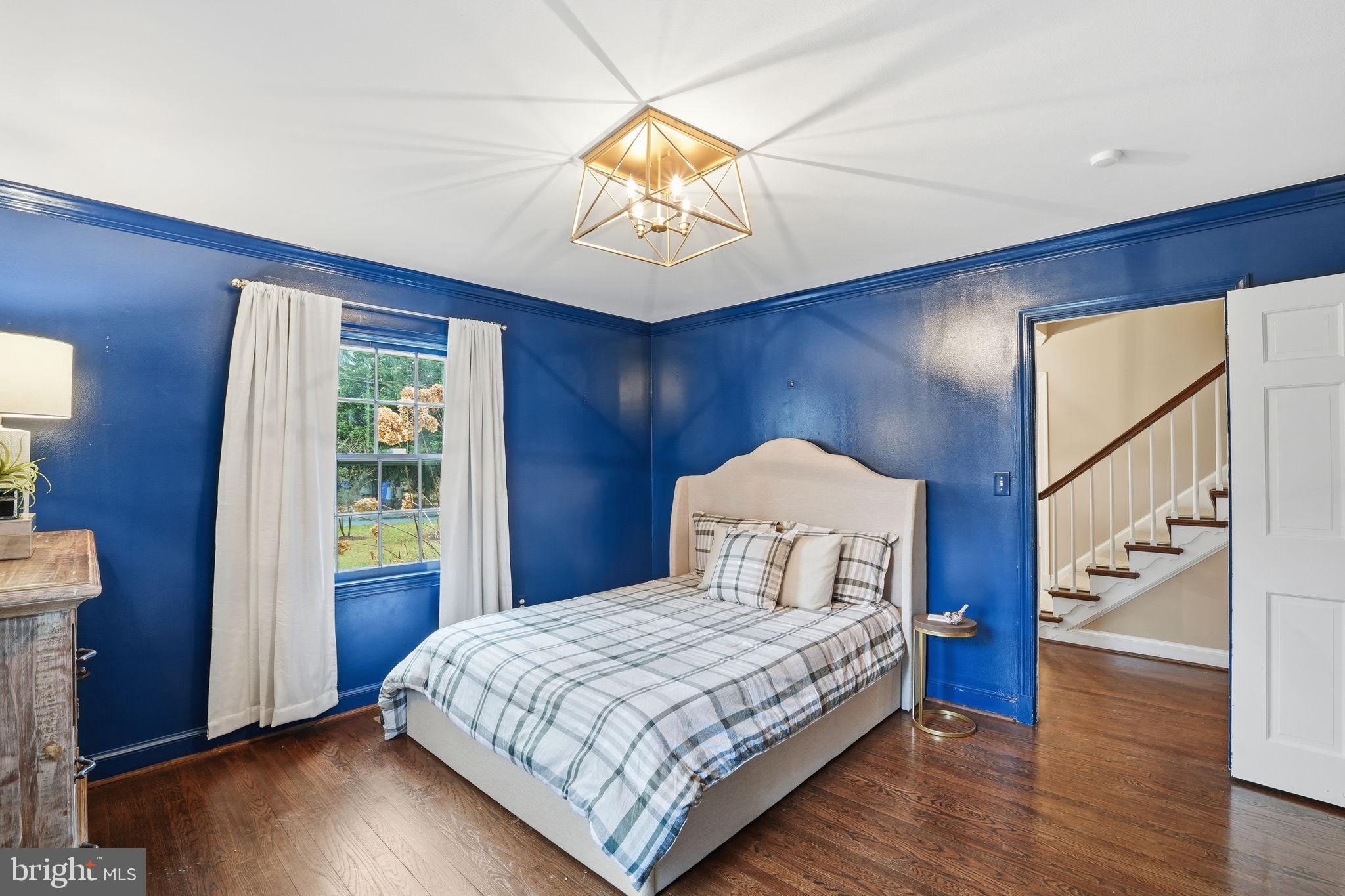 8436 Burning Tree Road Bethesda, MD 20817 - Photo 13 of 34 a bedroom with a bed and a window