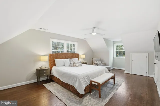 a bedroom with a bed and a lamp