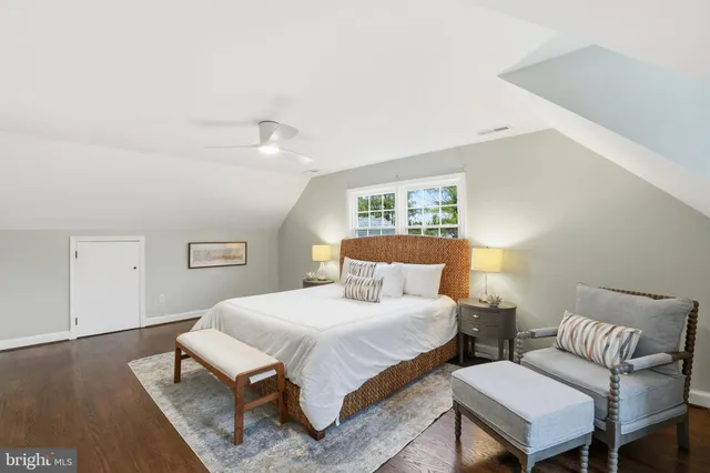 a bedroom with a bed and a couch