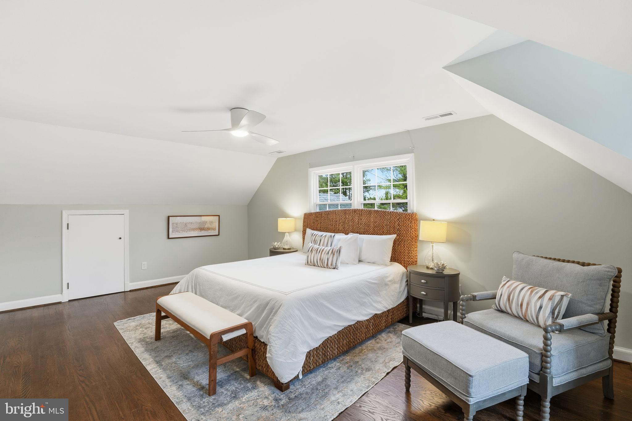 8436 Burning Tree Road Bethesda, MD 20817 - Photo 19 of 34 a bedroom with a bed and a couch