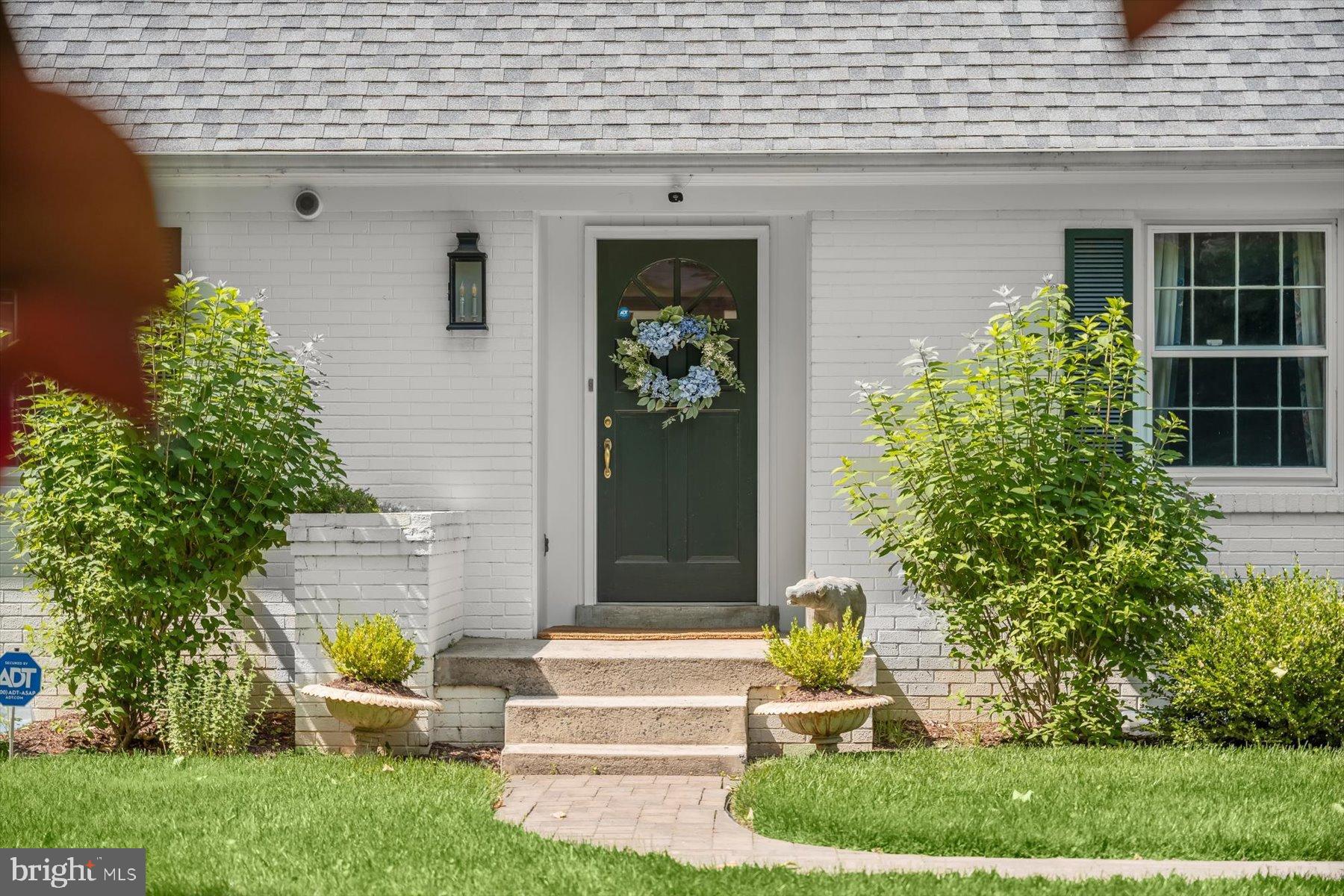 8436 Burning Tree Road Bethesda, MD 20817 - Photo 2 of 34 a front view of a house with garden