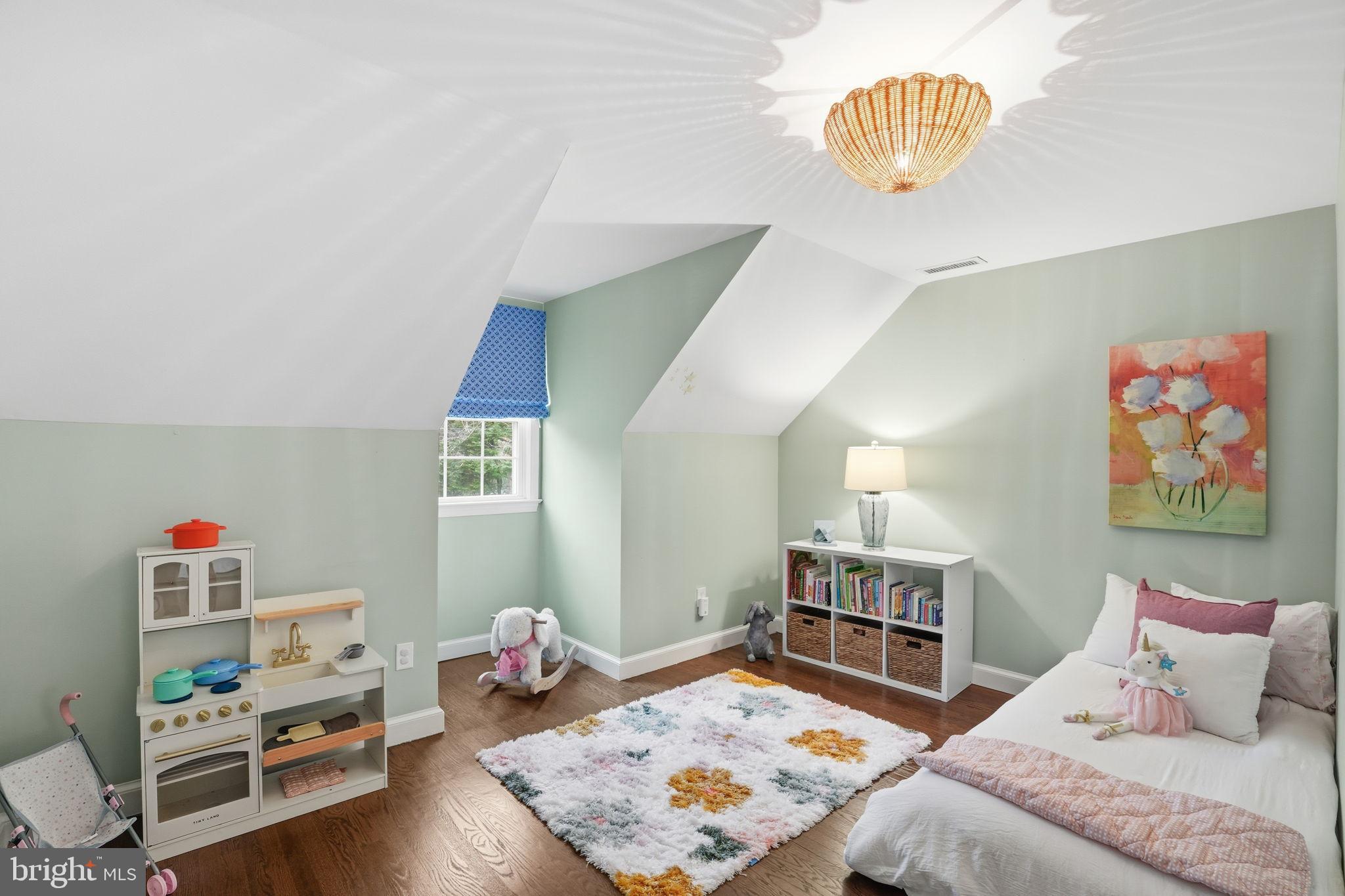 8436 Burning Tree Road Bethesda, MD 20817 - Photo 23 of 34 a bedroom with furniture and a wooden floor