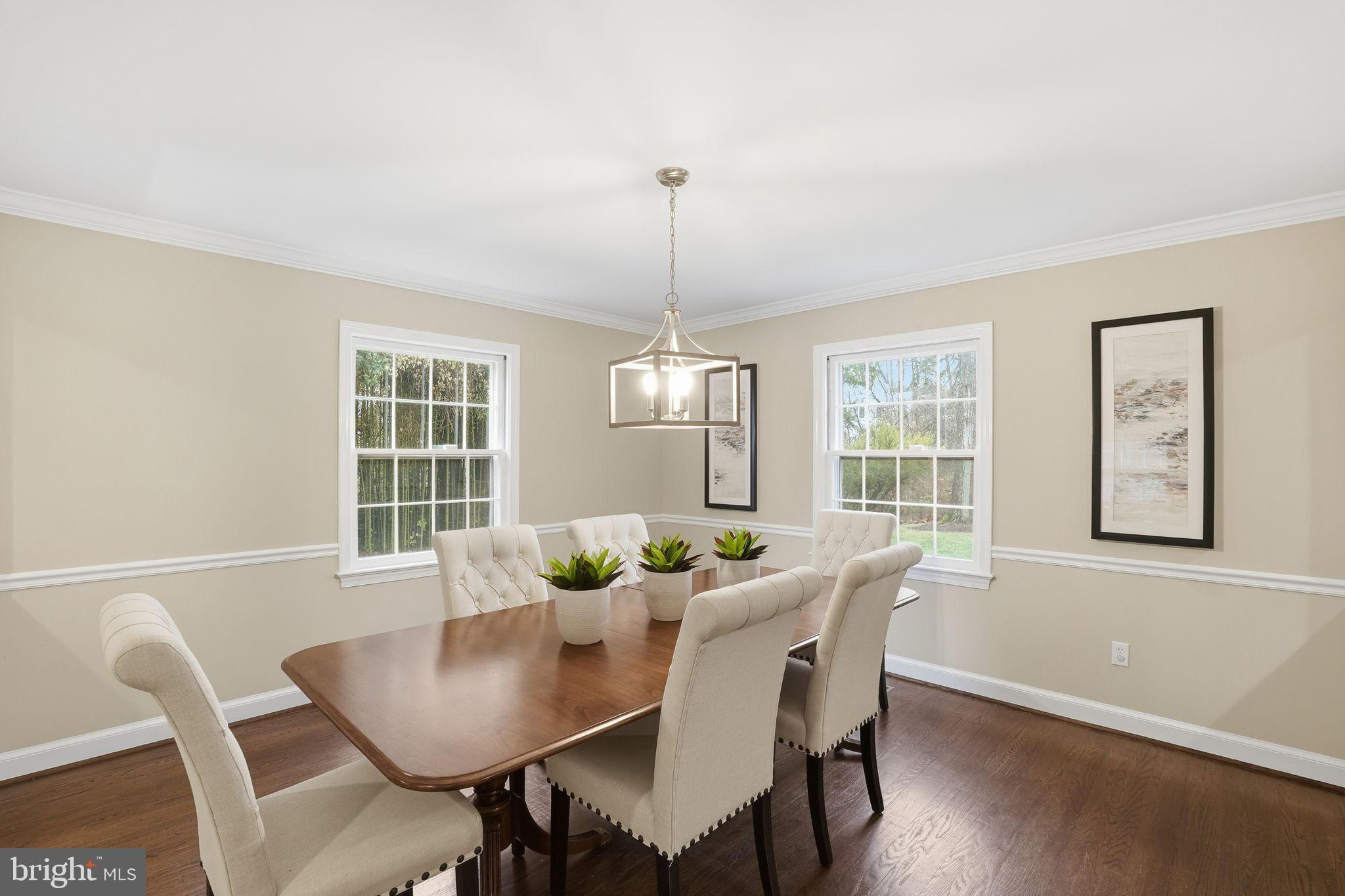 8436 Burning Tree Road Bethesda, MD 20817 - Photo 7 of 34 a dining room with furniture a window and wooden floor