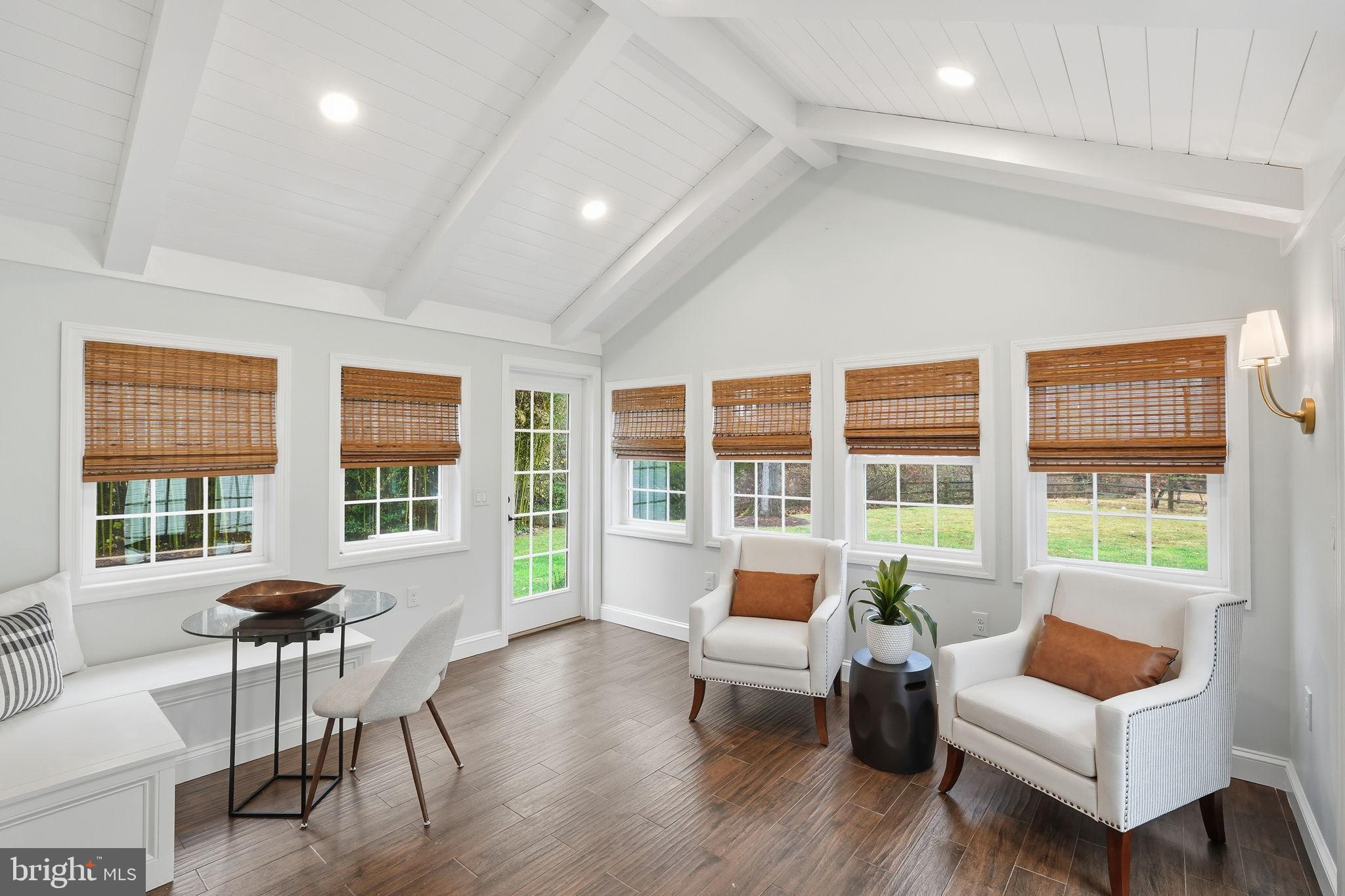 8436 Burning Tree Road Bethesda, MD 20817 - Photo 8 of 34 a living room with furniture and a large window