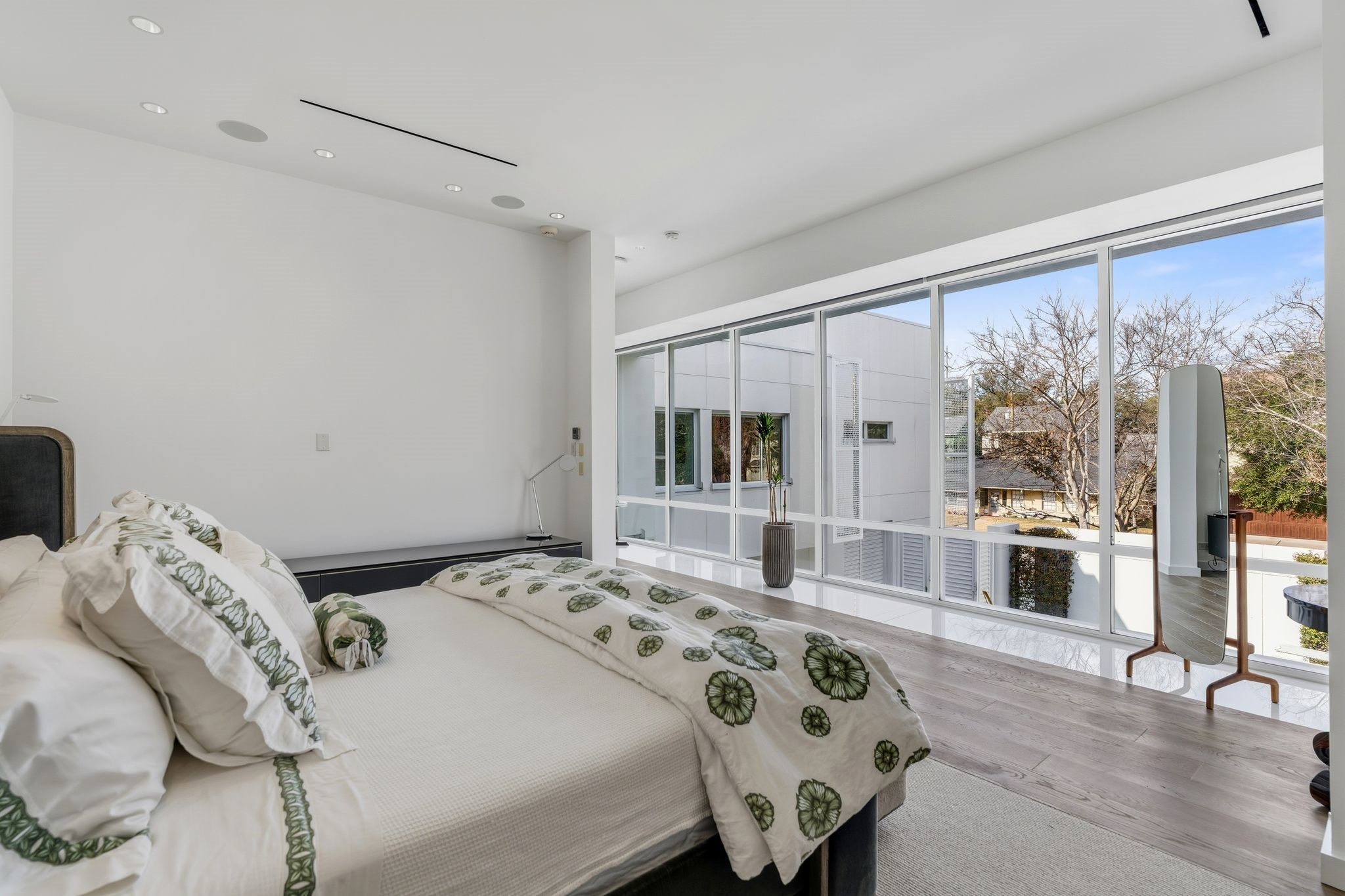 1509 Banks Street Houston, TX 77006 - Photo 20 of 40 a bedroom with a bed and a large window