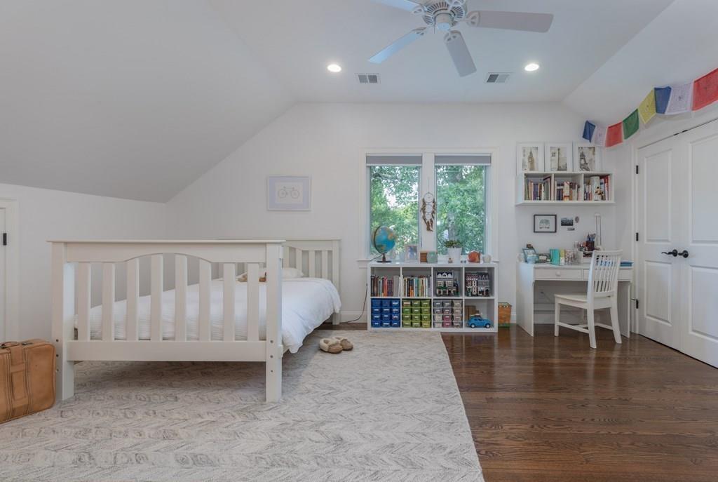 45 Village Circle Newton, MA 02459 - Photo 11 of 18 a spacious bedroom with a bed and a book shelf