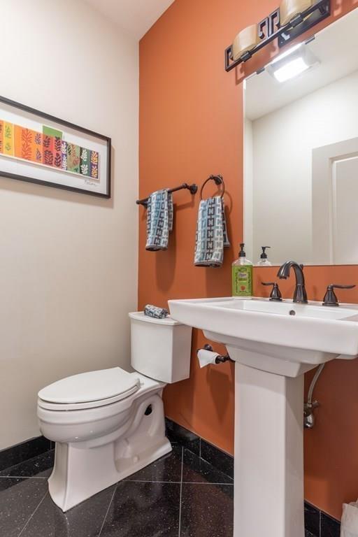 45 Village Circle Newton, MA 02459 - Photo 14 of 18 a bathroom with a toilet a sink and mirror