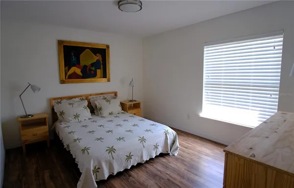 a view of a workspace with furniture and book shelf