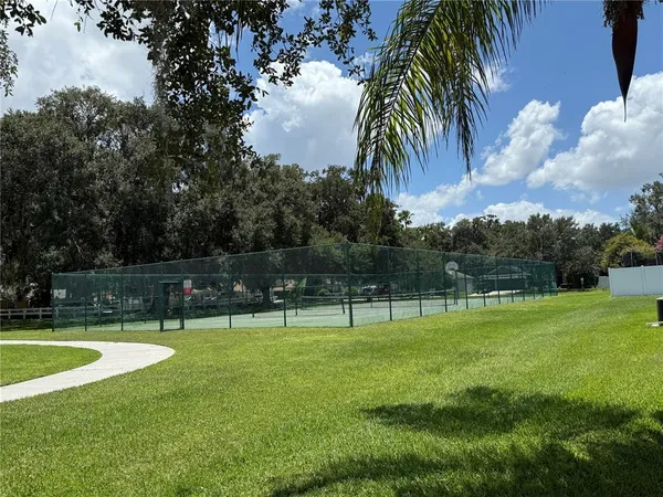 a view of swimming pool with a yard