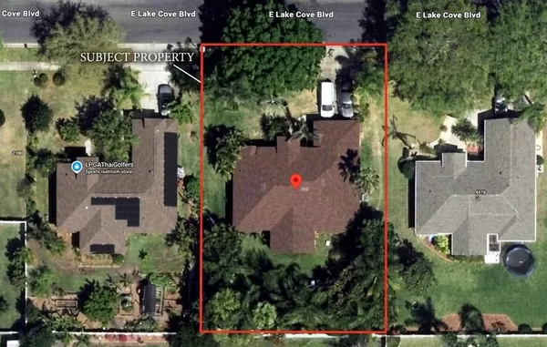 a view of a dining room with furniture and a chandelier