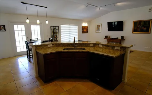 a view of a dining room with furniture and window