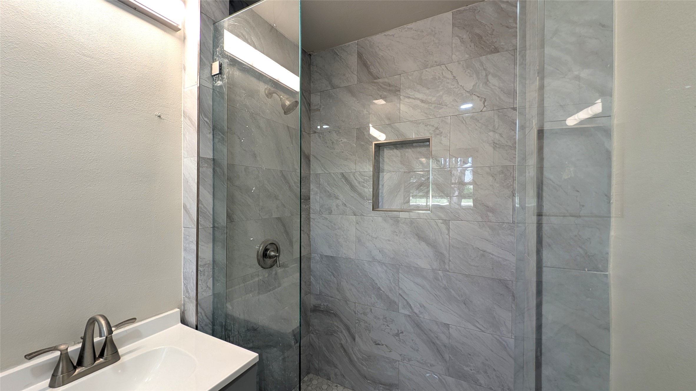 11811 Sleepy Hollow Road Manchaca, TX 78652 - Photo 16 of 31 a bathroom with a shower and a sink