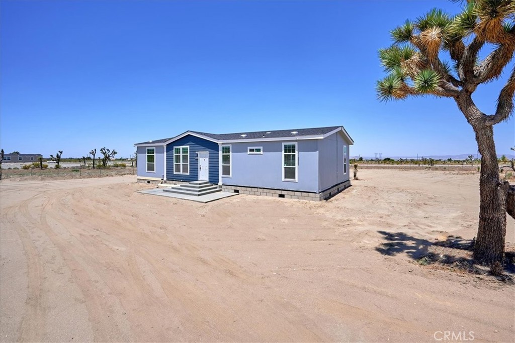 1824 Arcadia Road Pinon Hills, CA 92371 - Photo 1 of 1 a house with trees in front of it