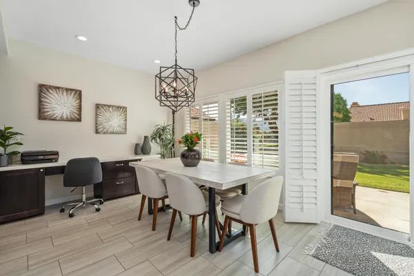 a view of a dining room with furniture window and outside view