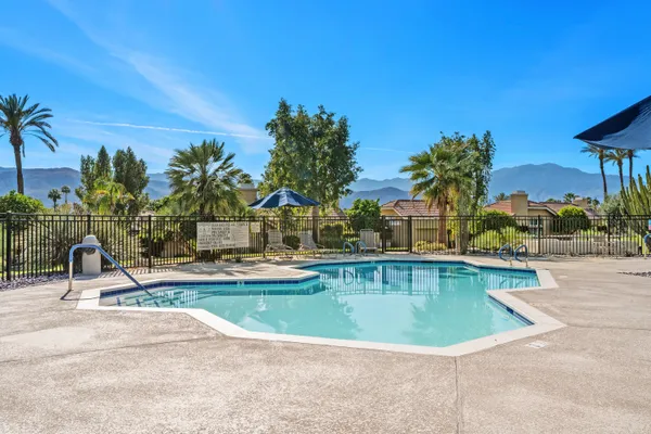 a view of a swimming pool with a patio