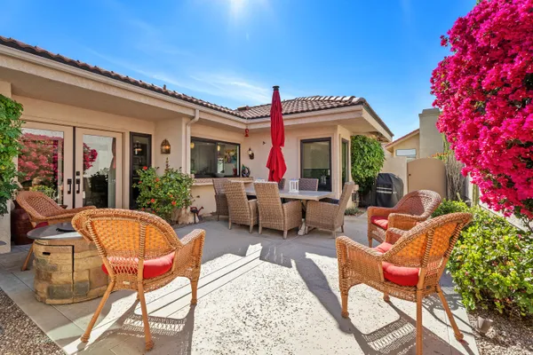 a backyard of a house with seating space