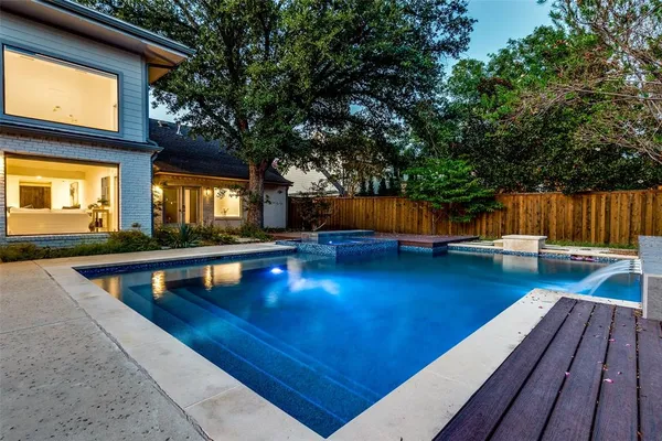 a view of a house with pool on roof deck