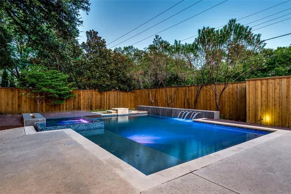 a view of a swimming pool with a lounge chairs